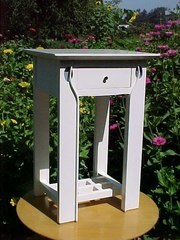 Mackintosh inspired nightstand in white lacquer.